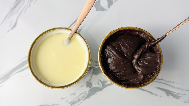 bowls of brown and white cream filling