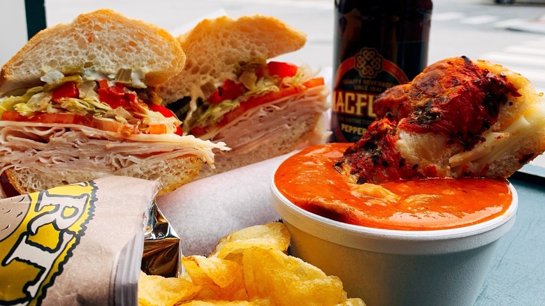 A sandwich with soup and potatoe chips at J.P. Graziano Grocery in Chicago