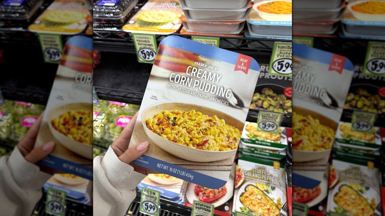Hand holding box of Creamy Corn Pudding.