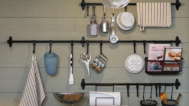 HULTARP hung against a wall displaying a variety of kitchen items