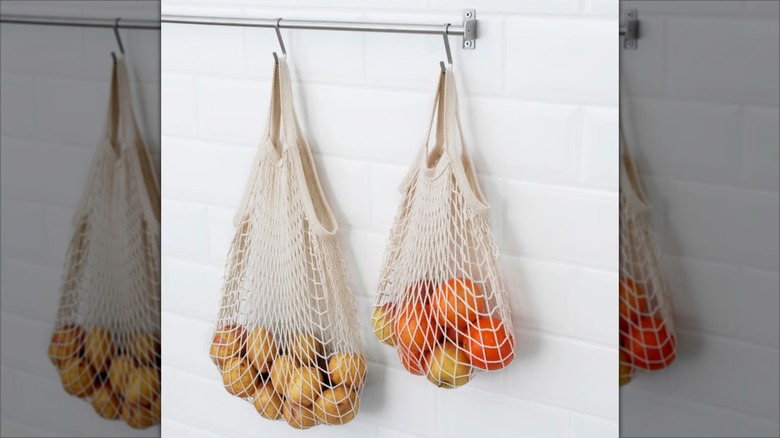 Hanging KUNGSFORS bags filled with produce
