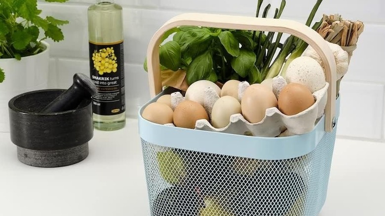 Blue RISATORP basket filled with kitchen produce