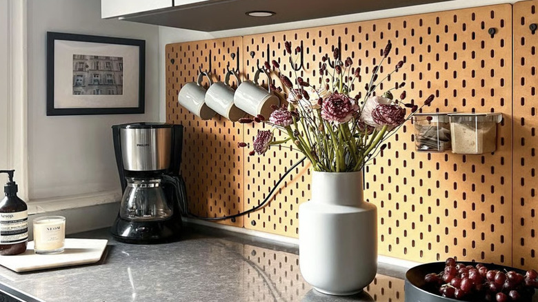 Counterspace with SKÅDIS pegboard in background with mugs hanging