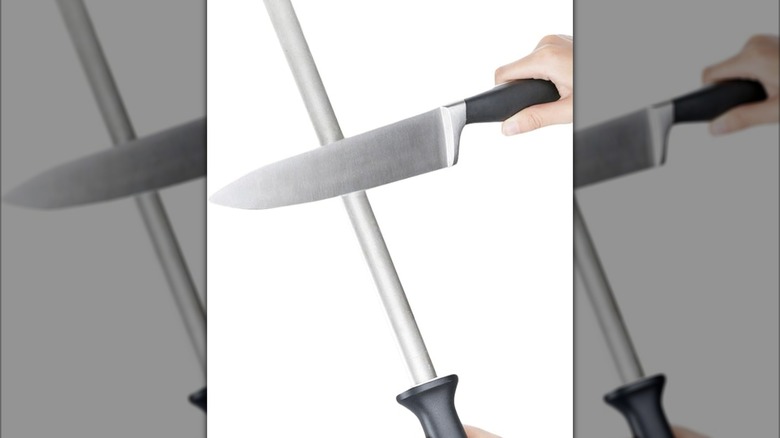 A sharpening rod with a knife