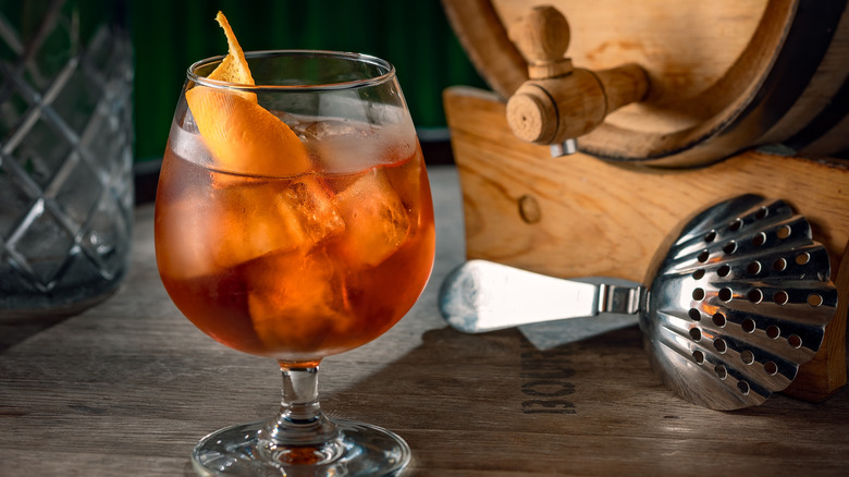 Aged rum cocktail with an orange swath garnish
