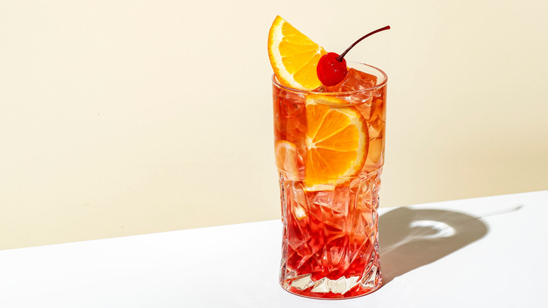Bourbon and cherry soda cocktail with fresh orange slices