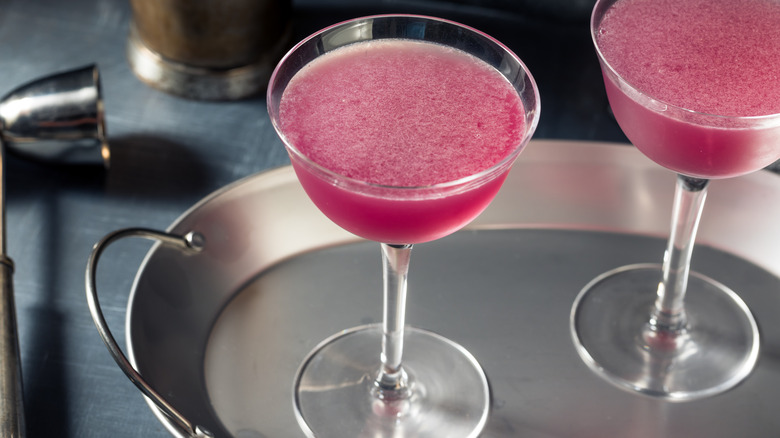 Dark red-ish purple aviation martinis on a silver tray