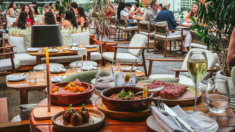 Meal at Level 6 with rooftop in background