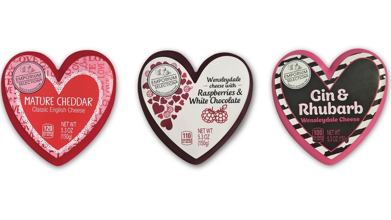 Three heart-shaped boxes with cheese and chocolates.