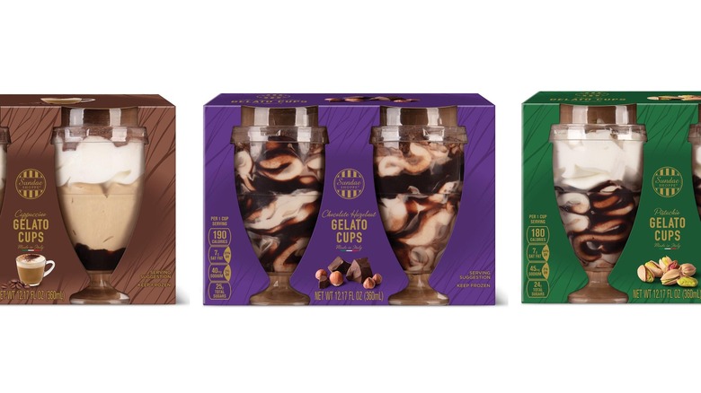 Three boxes of gelato cups with pictures of each flavor on the boxes.