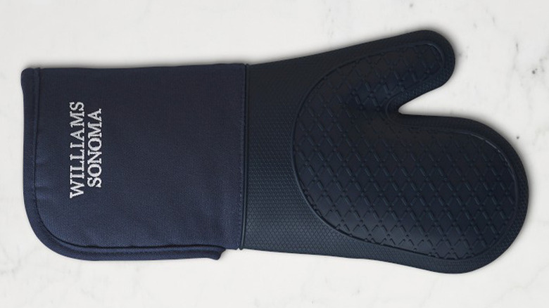 A single navy blue Williams Sonoma Ultimate Oven Mitt