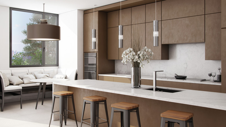 a kitchen with brown cabinets