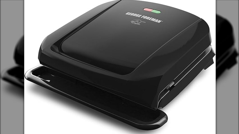 A panini press shows a large drip tray in front.
