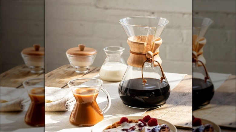 Classic Pour-over glass coffee maker on wooden table