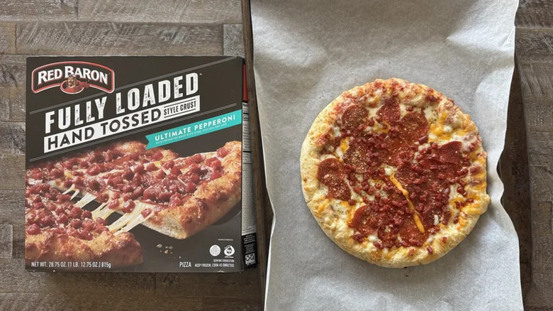Red Baron's fully loaded hand tossed style crust ultimate pepperoni photographed in and out of its box.
