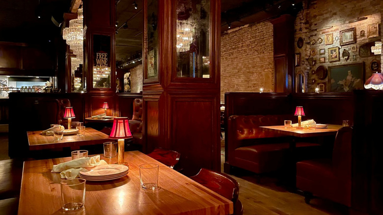 Bavette's Steakhouse's laidback interior, with comfortable couches and moody lighting.