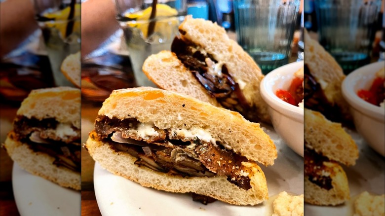 Two halves of a steak sandwich