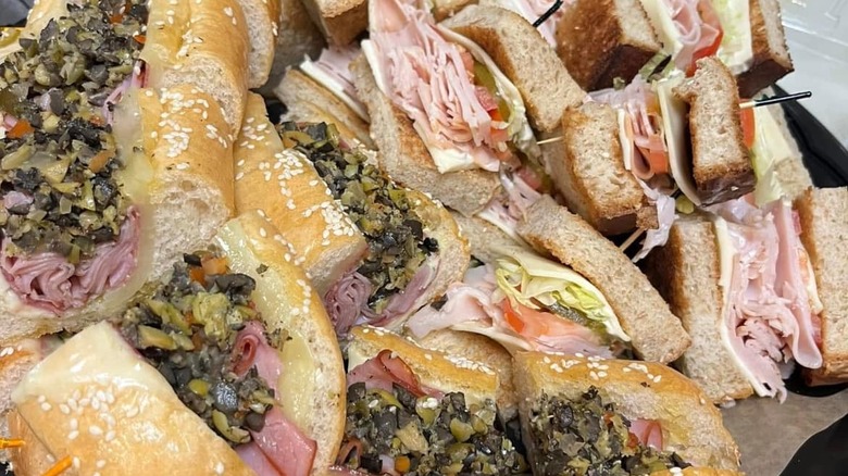 Sandwiches cut up on a serving platter