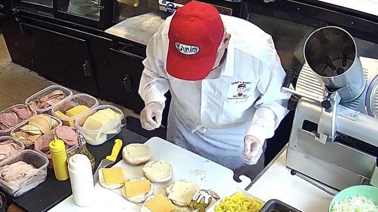 Ernie preparing sandwiches at his deli