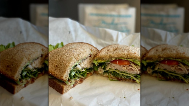 Two halves of turkey sandwich