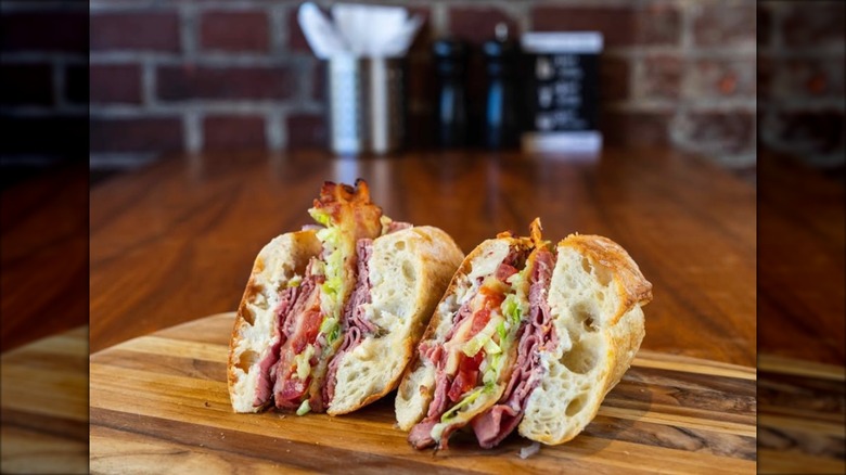 Two halves of a sandwich on a plate