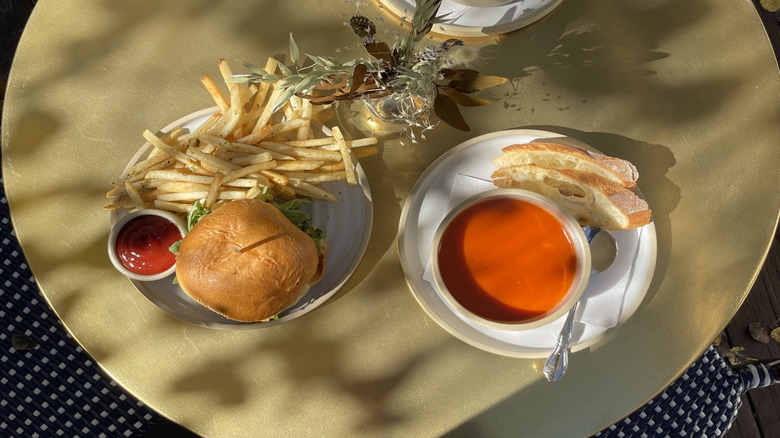 Soups and a burger on a table