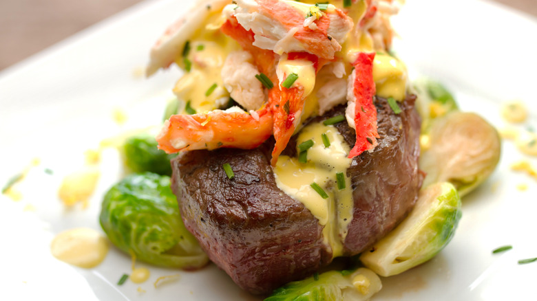 steak with hollandaise sauce crab and brussel sprouts