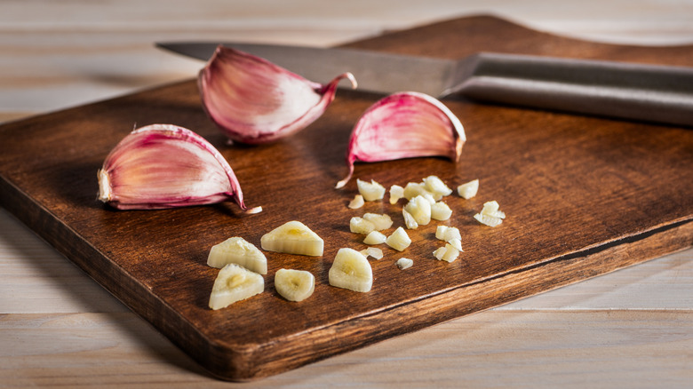 Garlic on a wooden chopping board