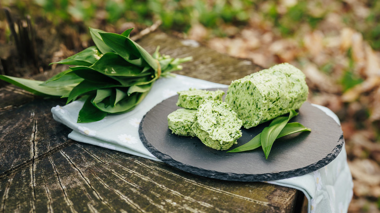 Homemade herb compound butter on a stone plate