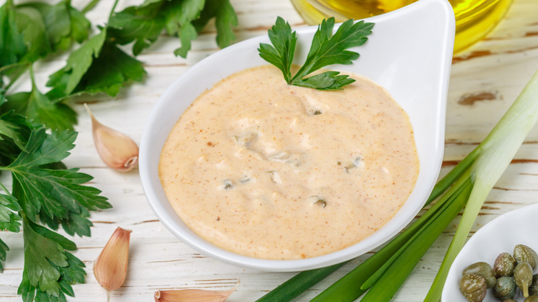 French remoulade with ingredients in a white bowl