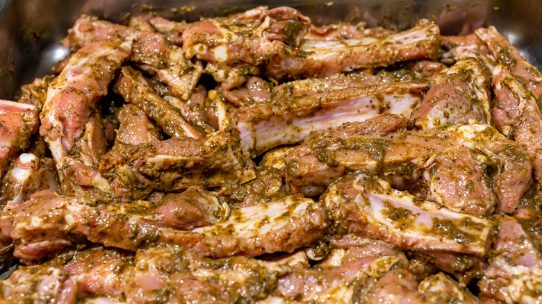 Pork ribs marinating in Jamaican jerk sauce
