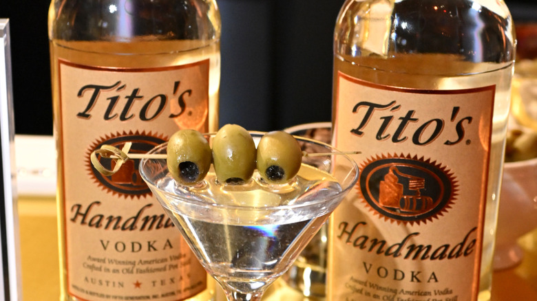 Two bottles of Tito's Handmade Vodka with a martini