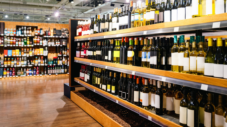 Wines at on shelves a liquor store.