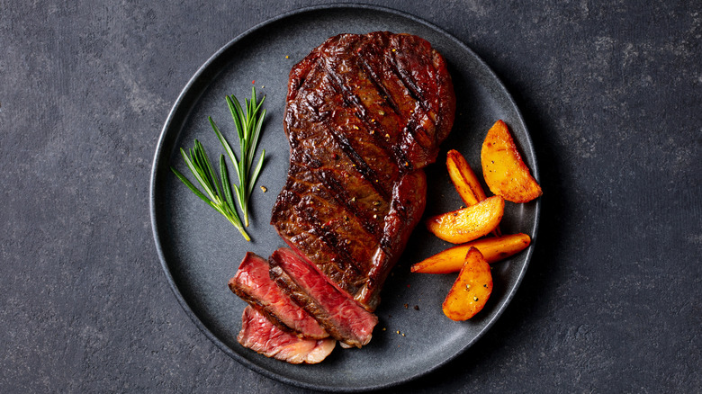 Grilled sirloin on dark plate