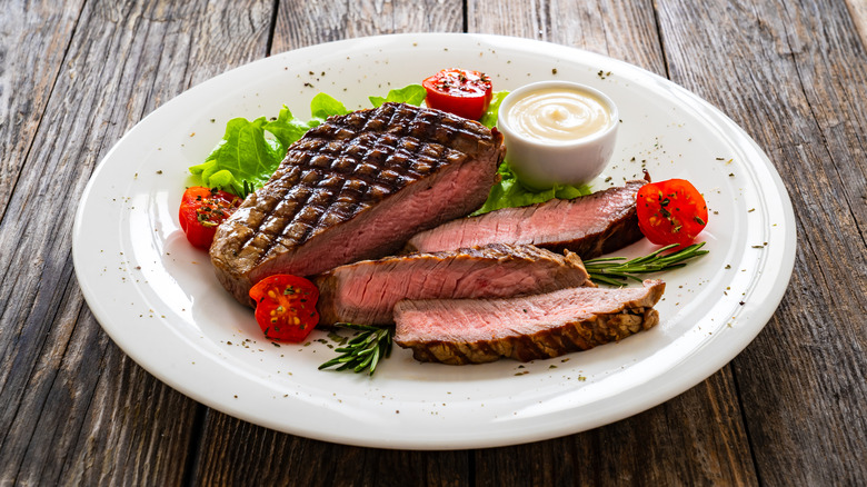 Sirloin steak on white plate