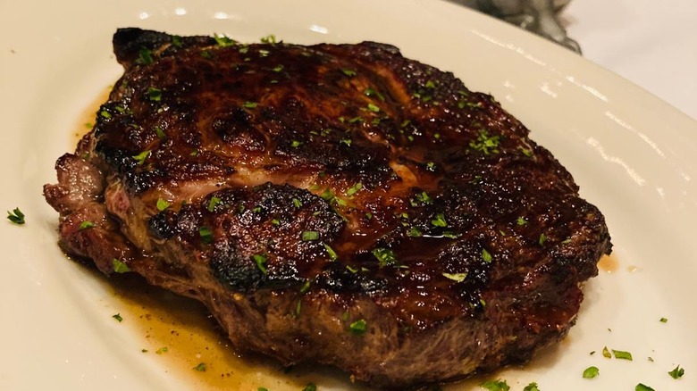 Morton's Cajun ribeye on a white plate.