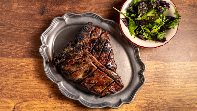 Porterhouse and salad at American Beauty