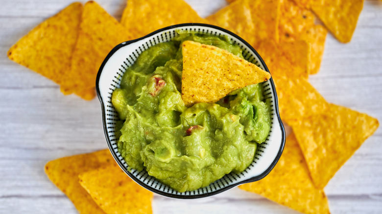 Tortilla chips with a bowl of guacamole