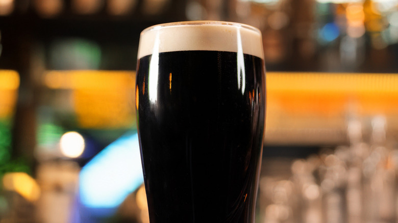 Pint of stout beer sitting on a bar