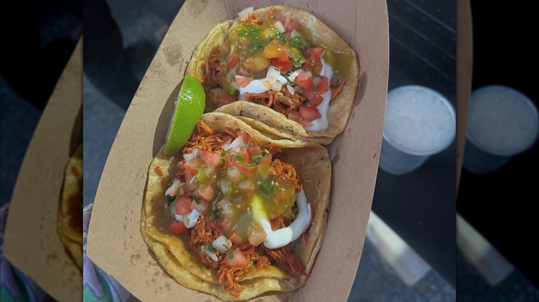 Tacos in a cardboard plate from Taco Maya