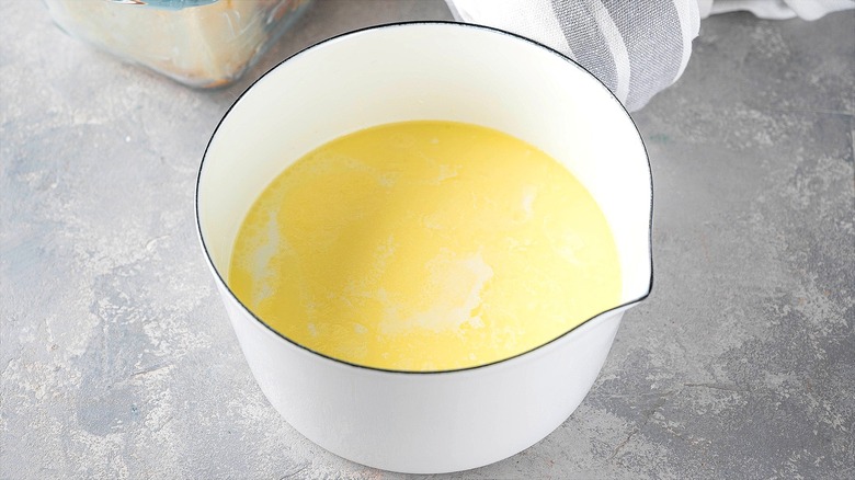 Melted butter and milk in a spouted while bowl