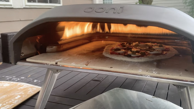 Ooni Koda 16 inch pizza oven with pizza inside