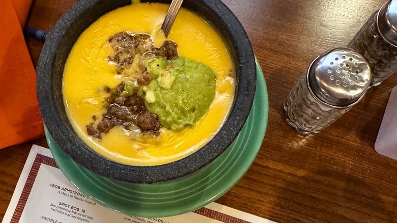 The Bob Armstrong dip alongside the menu from Matt's El Rancho.