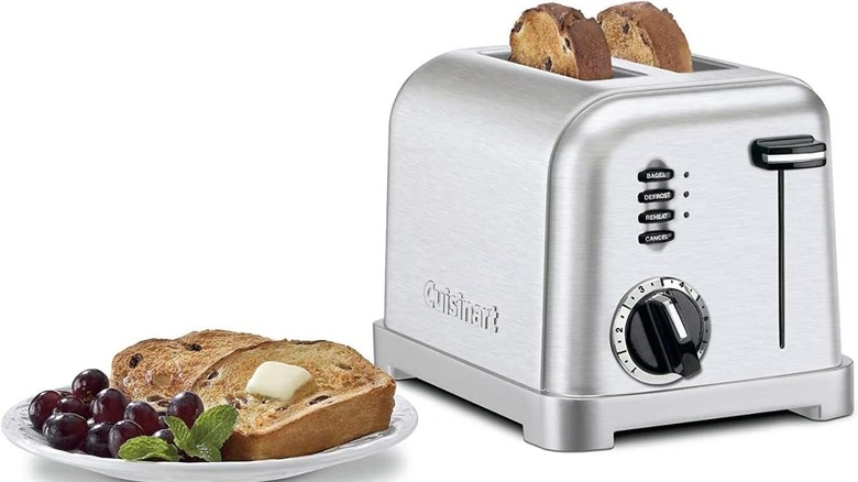Product image of the Cuisinart CPT-160 Metal Classic 2-Slice Toaster next to some grapes and toast