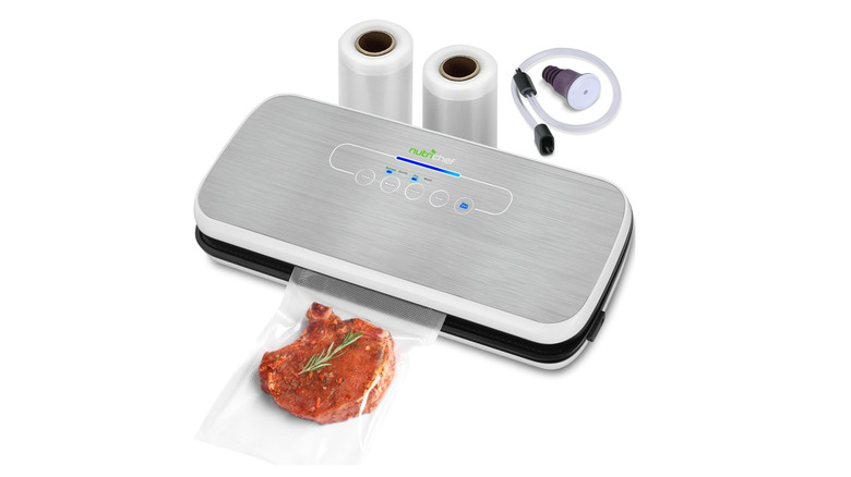 silver vacuum sealer with a steak and accessories