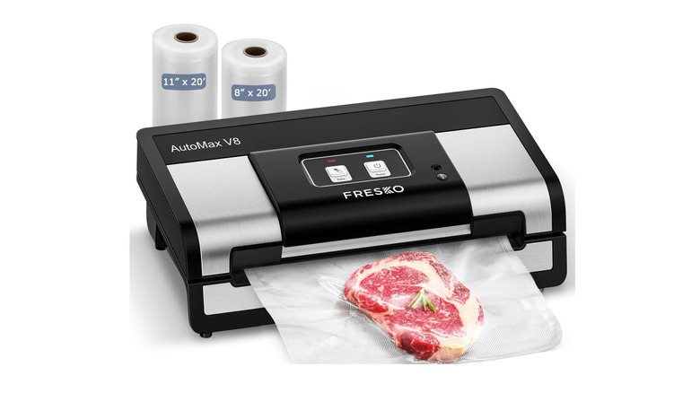 black and silver food sealer sealing a steak