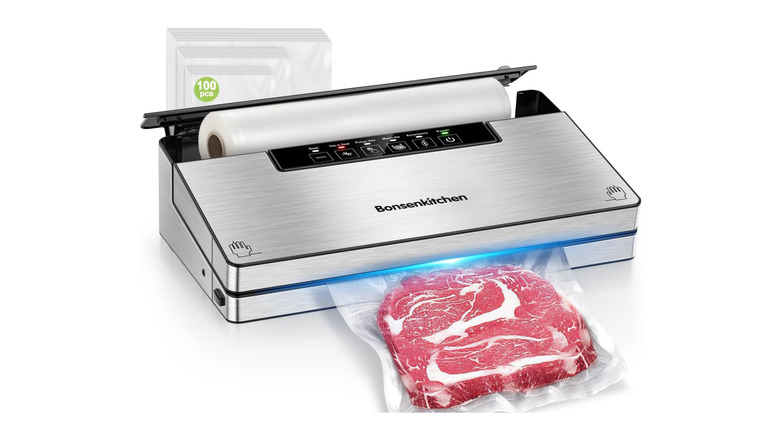 silver food sealer vacuuming a steak