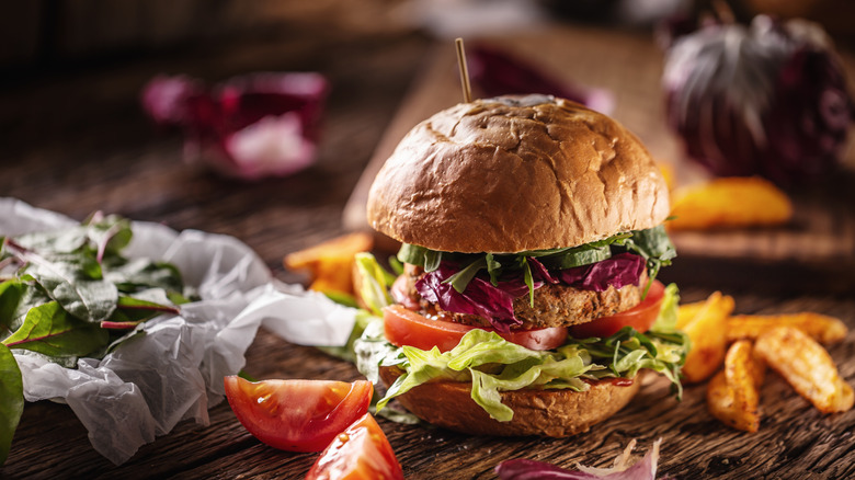 a vegan burger held together by a toothpick
