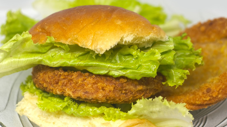 fried tofu burger on bun with lettuce
