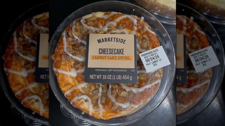 Overhead angle of a whole Marketside Carrot Cake Swirl Cheesecake in its plastic container
